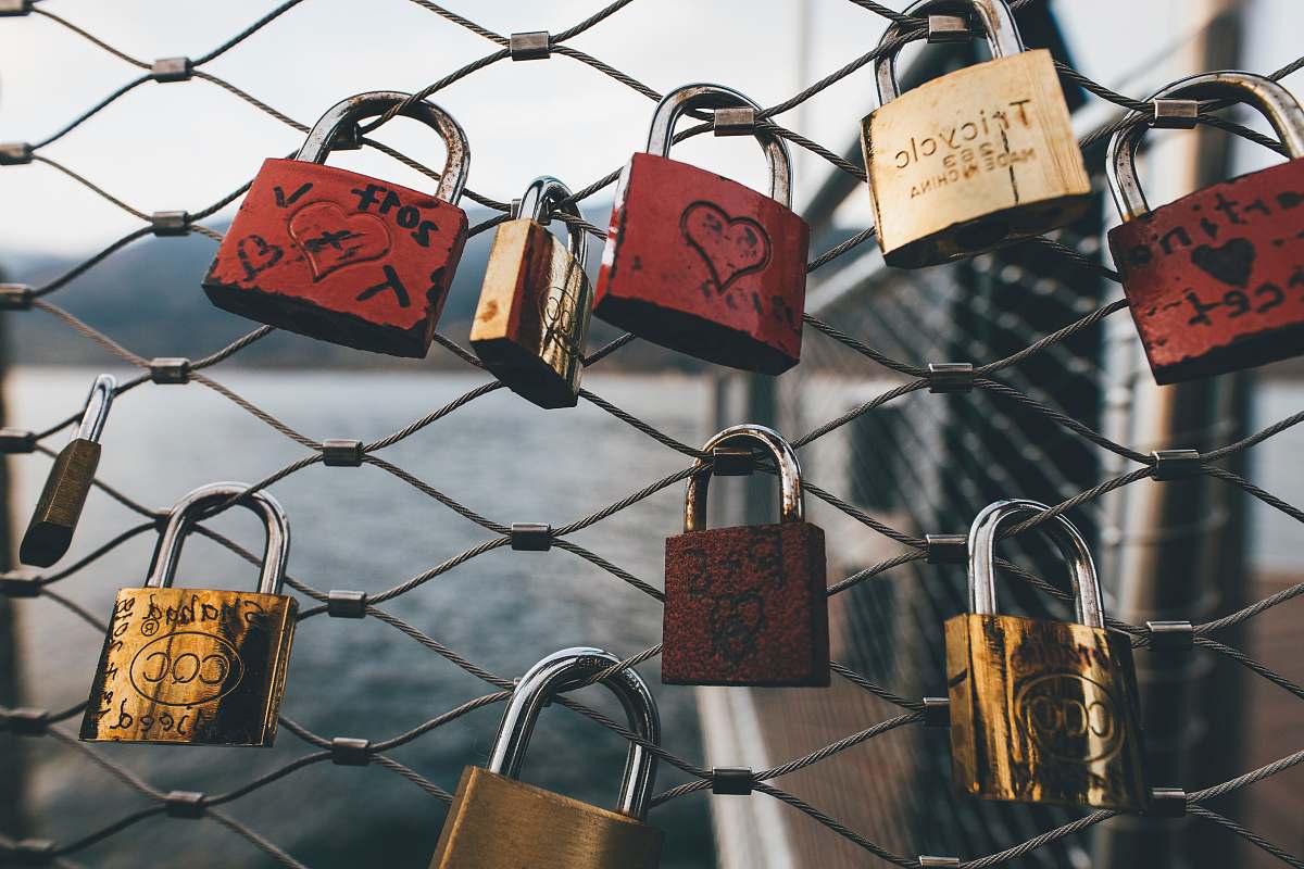 zeller see assorted-color padlocks on fence during daytime zell am see